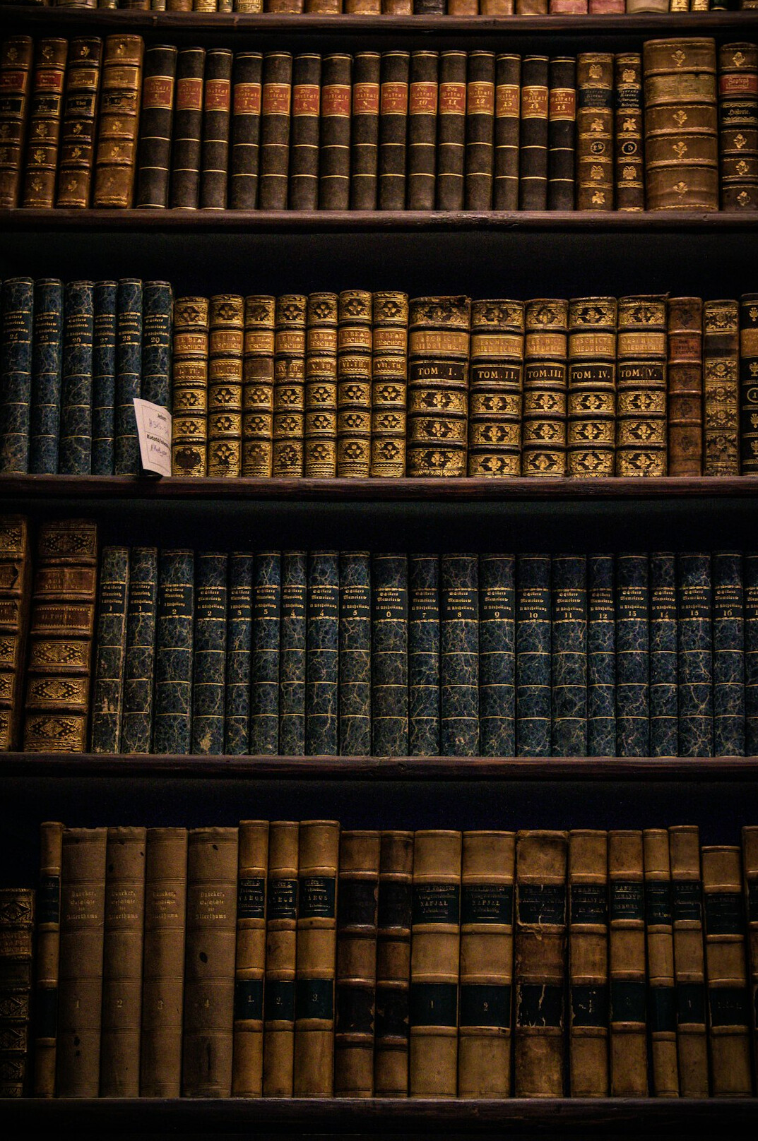 Shelves of old archive folders and historical documents