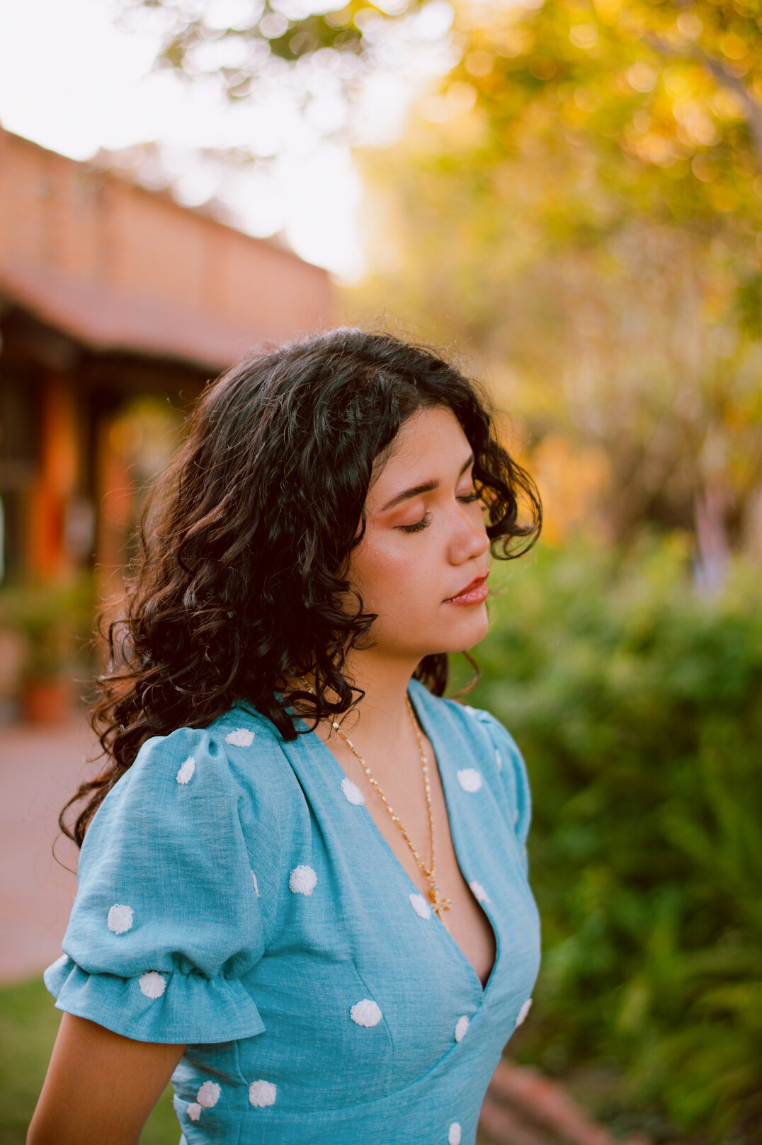 Portrait of a Latina woman editor in her forties with dark wavy hair